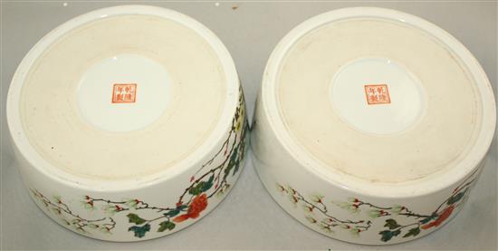 A pair of Chinese famille rose circular narcissus bowls, Qianlong marks, Republic period, 25cm, wood stands